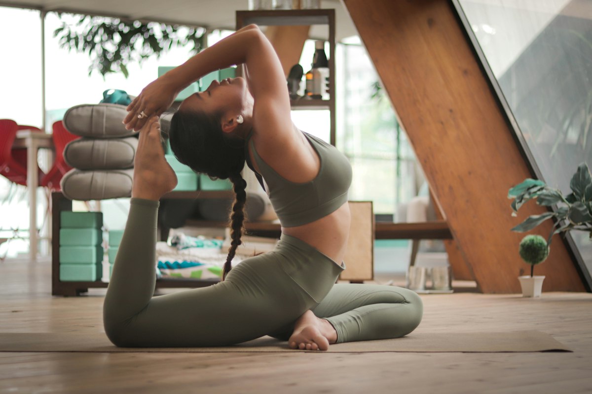 Group yoga class practicing together in a studio